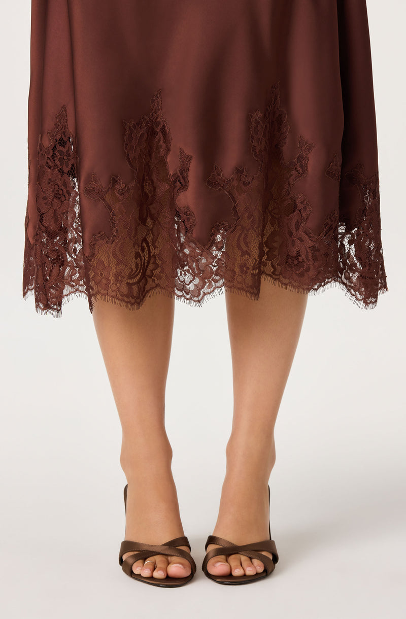 Brown satin midi skirt with lace trim at the hem.