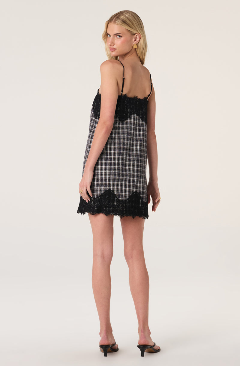 Black and white checkered slip dress with black lace trim and spaghetti straps.