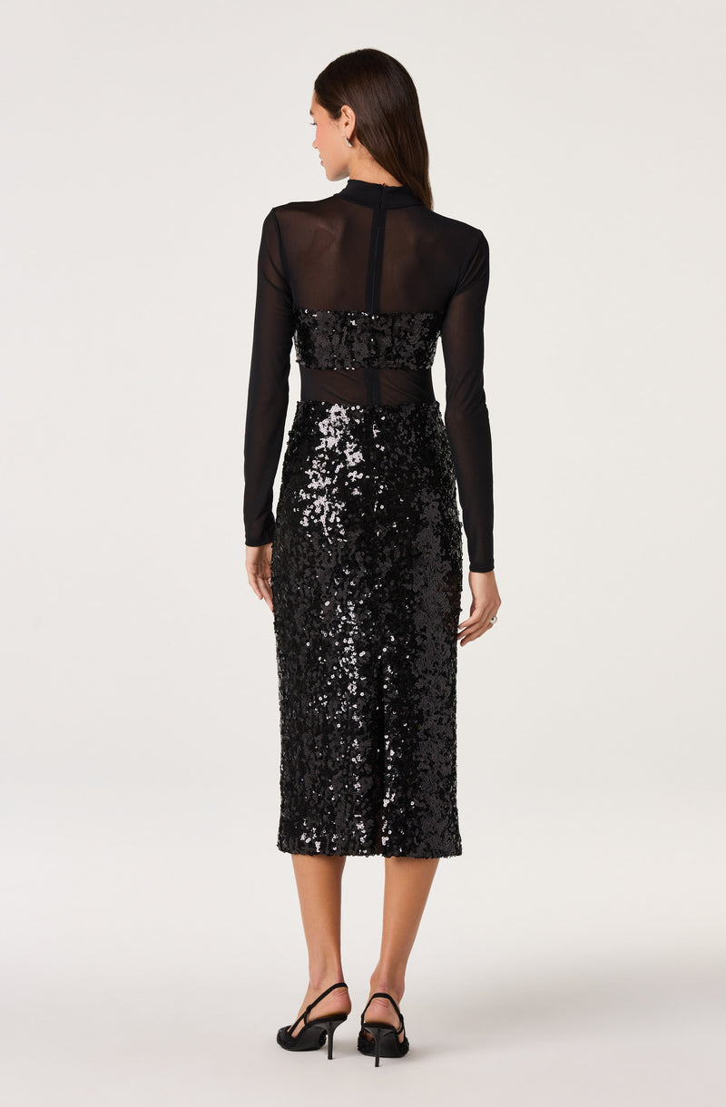 Black sheer long-sleeve top with sequined waistband and a high-waisted, black sequin midi skirt.