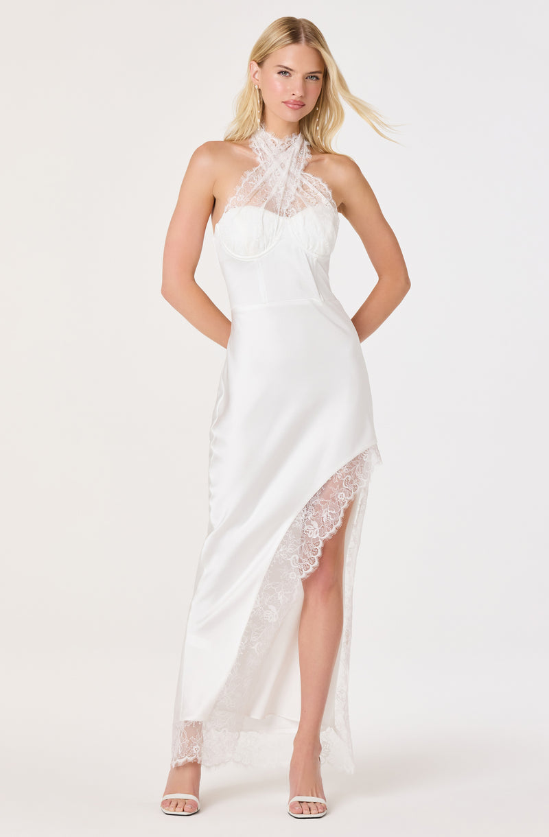 White satin gown with lace details, high neckline, sleeveless, and front slit.