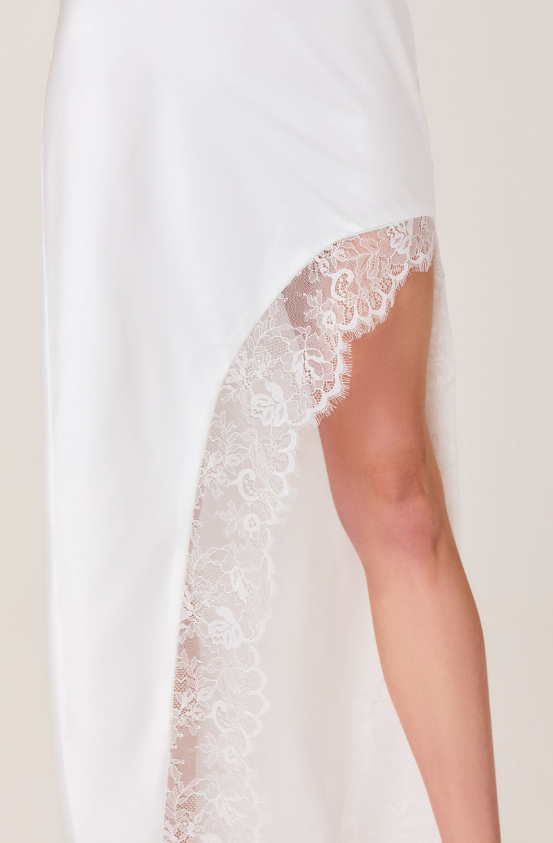White satin and lace nightgown with a high slit revealing the leg.