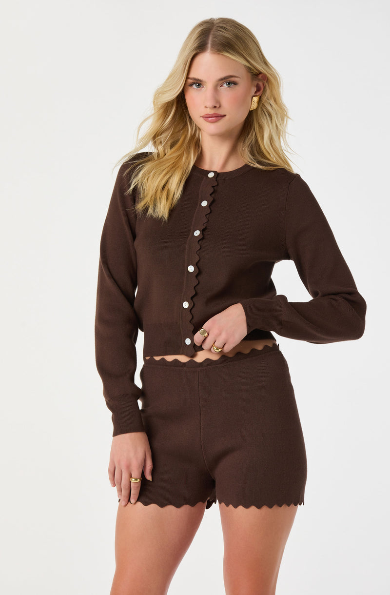 Brown matching long-sleeve cardigan and high-waisted shorts with scalloped edges.