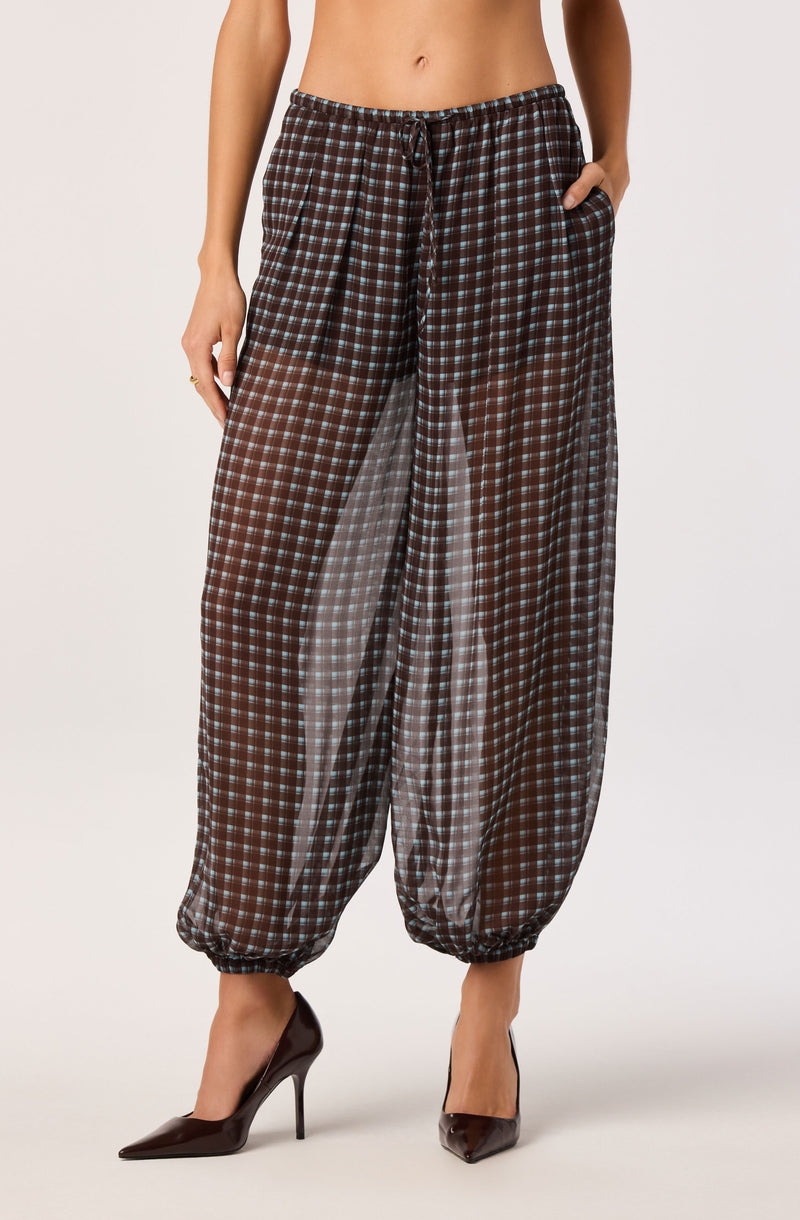 Checkered loose-fitting pants with an elastic waist and drawstring, ankle cuffs.