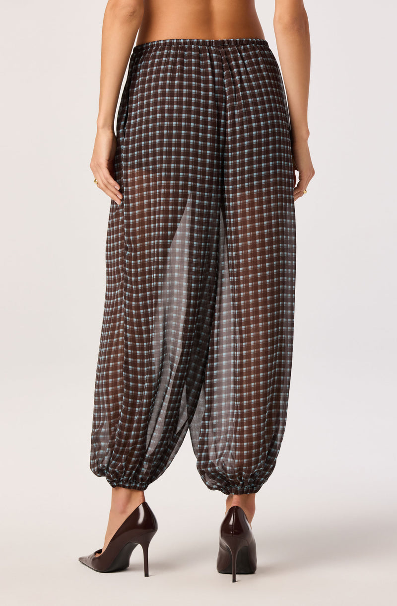 Black and brown checkered loose-fitting pants with elastic waistband and elastic cuffs.
