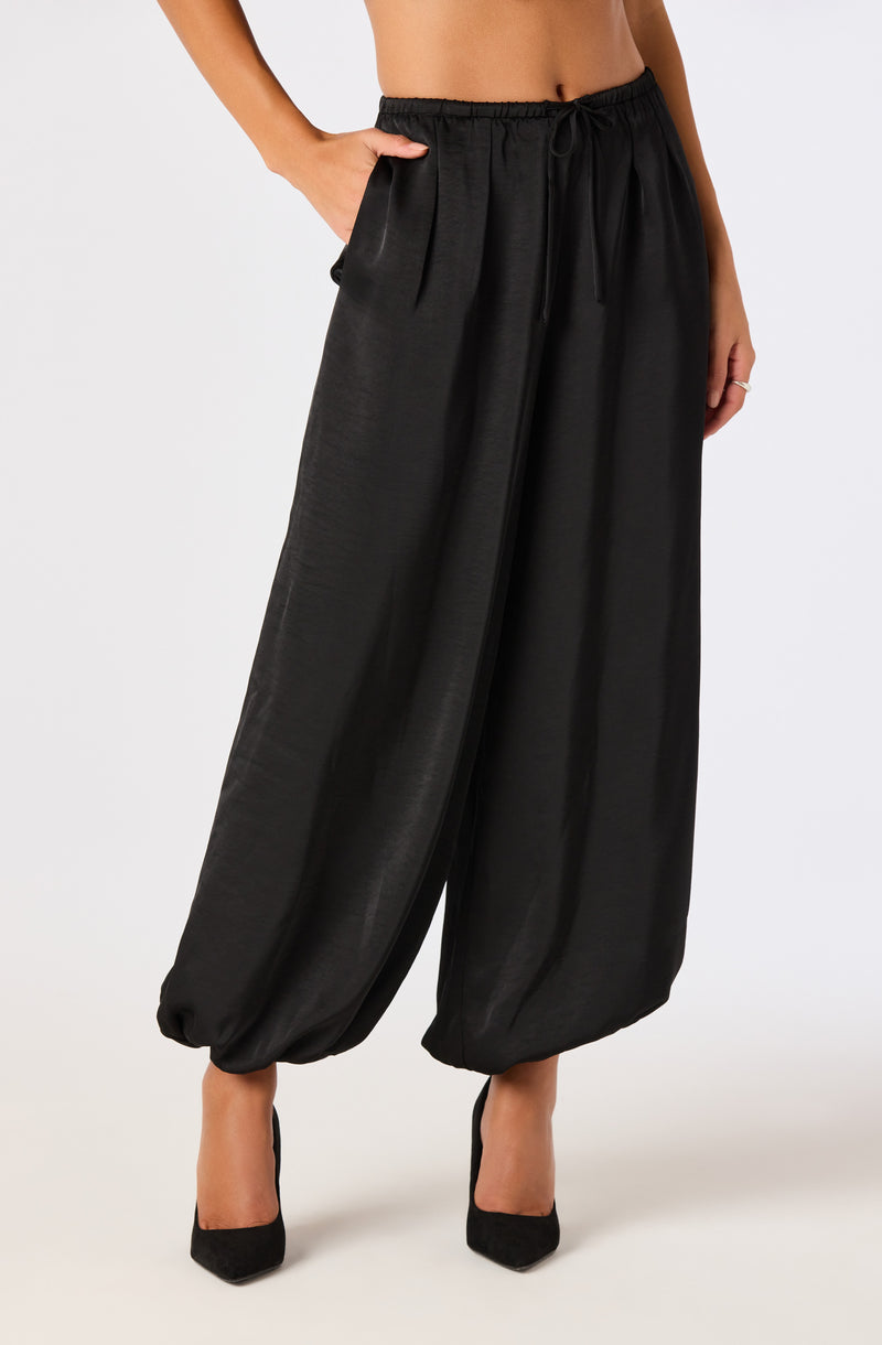 Black wide-leg pants with drawstring waist and elasticized cuffs.