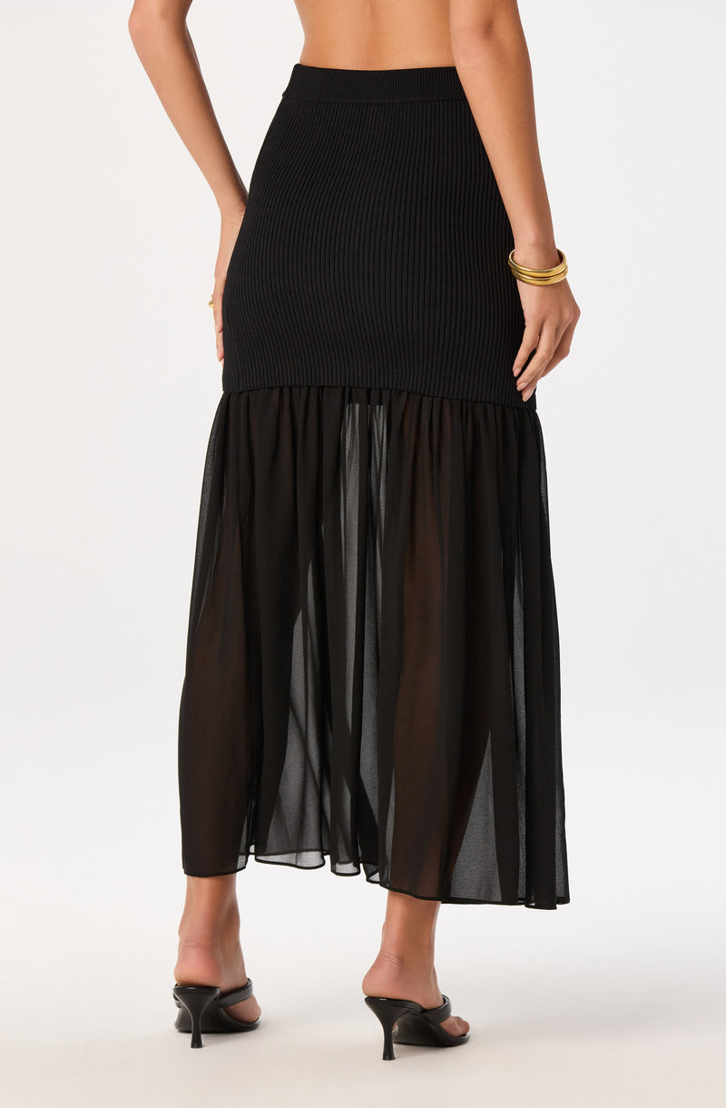 Black ribbed high-waisted skirt with sheer black layered fabric at the bottom.