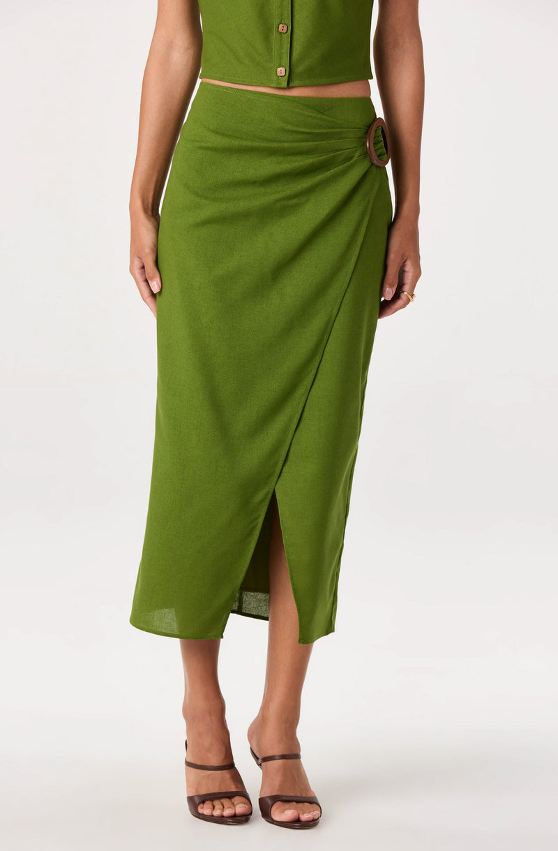 Green two-piece outfit with a cropped top and high-waisted, draped skirt featuring a side buckle.