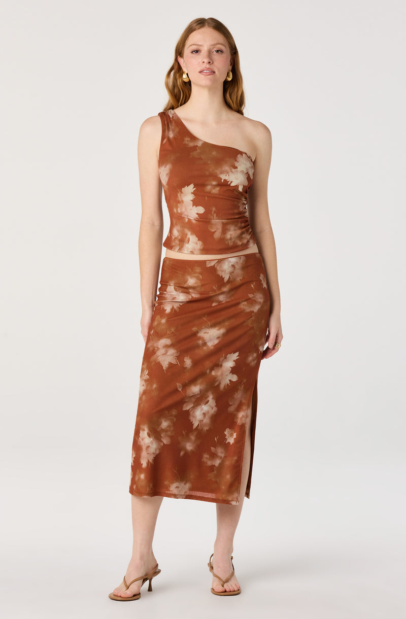 Brown tie-dye two-piece outfit with a sleeveless top and a matching midi skirt with a side slit.