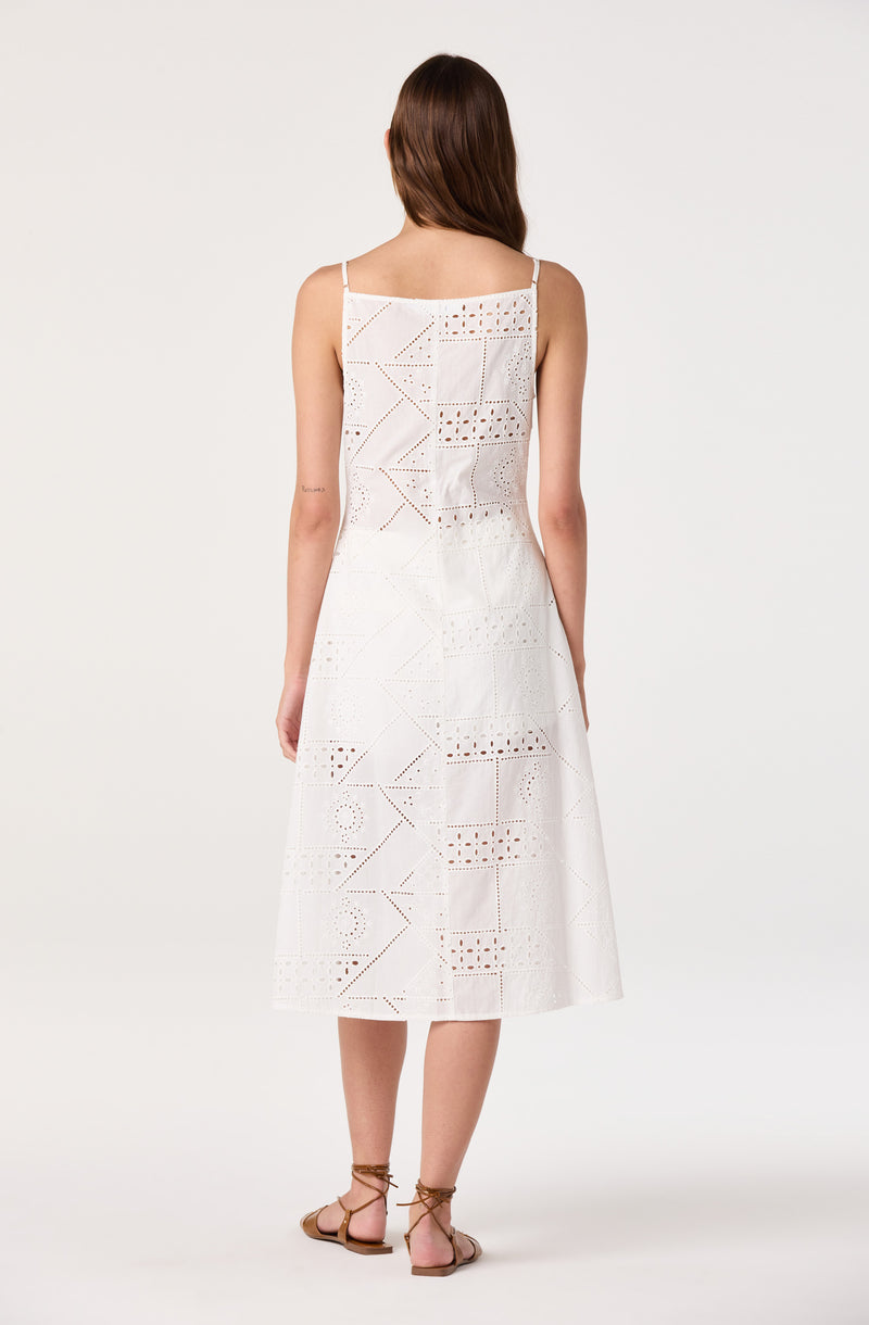 White embroidered sleeveless midi dress with thin straps.