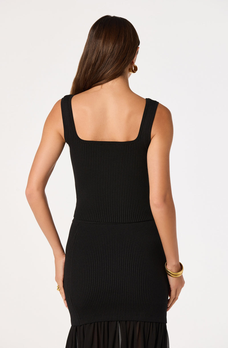 Black ribbed sleeveless dress with wide shoulder straps.