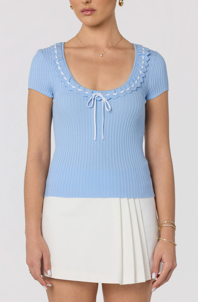 Light blue ribbed knit top with ruffled scoop neckline and front tie.