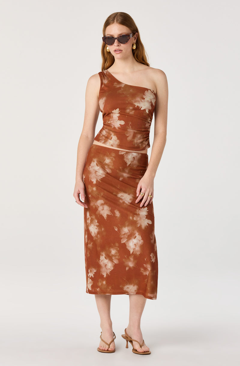 Brown tie-dye one-shoulder top with matching long skirt.
