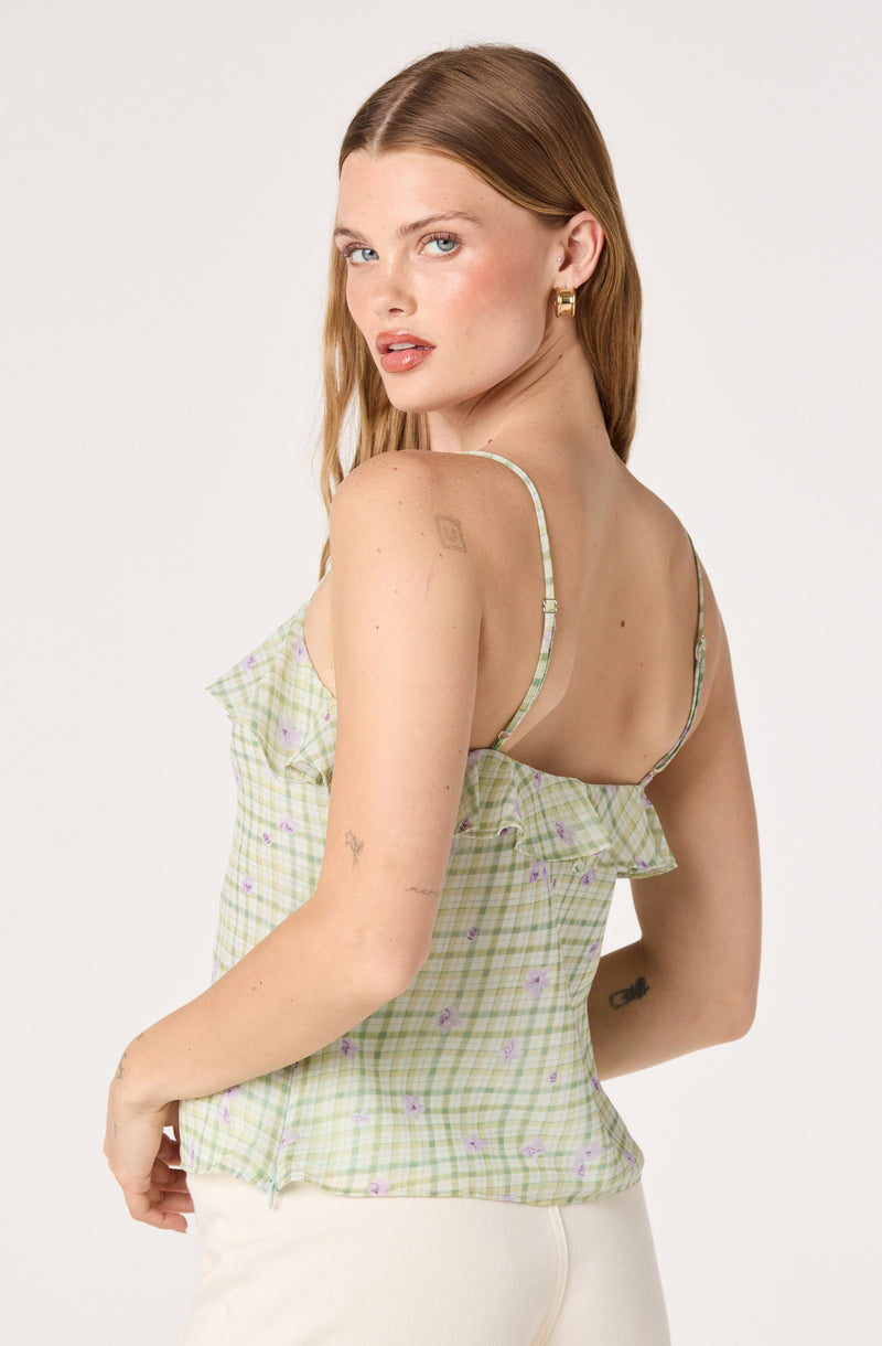 Light green checkered spaghetti strap top with ruffled detail and small purple floral pattern.