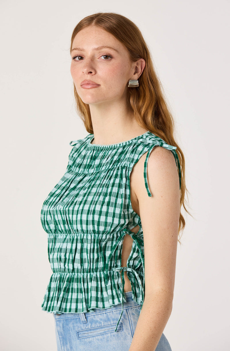 Green and white checkered sleeveless top with side tie details.