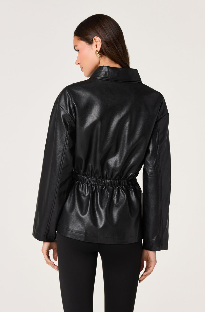 Black faux leather jacket with an elastic waist, worn with black pants.