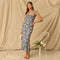 Long blue dress with yellow floral pattern and ruffled shoulder straps.